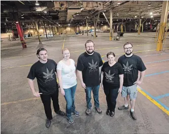  ?? MATHEW MCCARTHY WATERLOO REGION RECORD FILE PHOTO ?? Dan Bexon, left, Laura Foster, Nathan Woodworth, Krysta Woodworth and Adam Woodworth of James E. Wagner Cultivatio­n stand in the former Lear Corp. plant in Kitchener in this photo taken in 2017.
