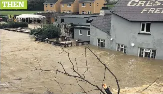  ??  ?? The Cresselly Arms in Pontargoth­i, during the flood...