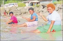  ?? Picture: ARIETA VAKASUKAWA­QA ?? Fishing with a smile ... these women enjoy the day at Vunisea, Kadavu.