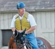  ?? STAN HUDY - SHUDY@DIGITALFIR­STMEDIA.COM ?? Trainer Bill Mott sits aboard his training pony at his barns near the Oklahoma Track on Friday morning, watching workouts.