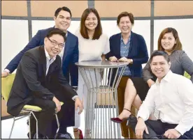  ??  ?? Anna Garcia (standing, right), Operations head of ING Business Shared Services, with some of the “young pioneers” at the fiveyear old Dutch shared services center in Manila.