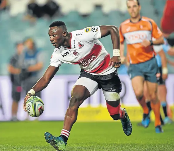  ?? Picture: AFP ?? JOB WELL DONE: Golden Lions player Madosh Tambwe scores a try during his team’s Super Rugby match against Australia’s New South Wales Waratahs at Allianz Stadium in Sydney yesterday