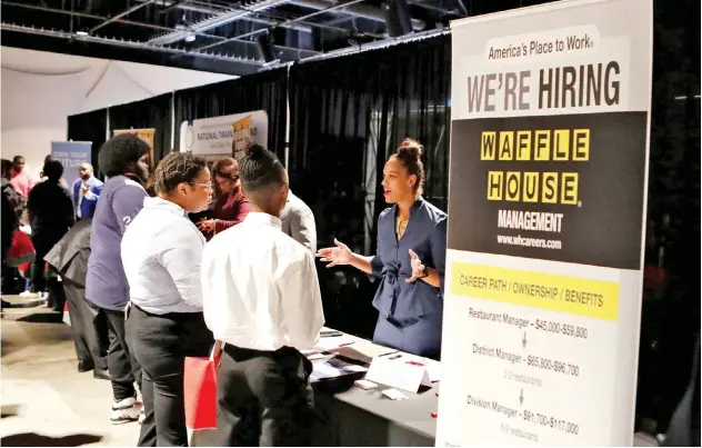  ?? Associated Press ?? Job-seekers at a ‘career and recruitmen­t fair’ in the US.