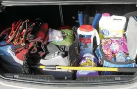  ?? KRISTI GARABRANDT — THE NEWS-HERALD ?? Blankets, emergency flares, salt, a flashlight, snacks, water, jumper cables and a first-aid kit are just some of the items that should be included in an emergency kit for your car when getting ready for winter.