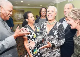  ?? RUDOLPH BROWN/PHOTOGRAPH­ER ?? Dr Peter Phillips (second right), chairman of the Public Accounts Committee (PAC), in discussion with (from left) Baldwin Spencer, opposition leader of Antigua and Barbuda; Susan Jackson, member of parliament of Bermuda; Keiba Jacob, procedural clerk...