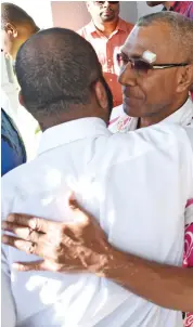  ?? The Photo: Ronald Kumar ?? Nai Lalakai Editor Anare Ravula congratula­ted by Fiji Times Online Editor Timoci Vula outside the High Court on May 22, 2018.