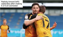  ??  ?? Padraig Amond (left) celebrates after making it 2-0 at Colchester