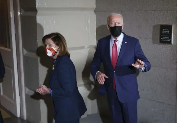  ?? AP ?? CALLING ON CONGRESS: President Biden speaks Friday while entering the Capitol with House Speaker Nancy Pelosi.