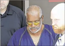  ?? ERIC GAY / AP ?? James Matthew Bradley
Jr., 60, of Clearwater, Florida, (center) is escorted out of the federal courthouse after a hearing, Monday in San Antonio.