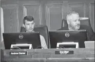  ?? NWA Democrat-Gazette/STACY RYBURN ?? City Planning Director Andrew Garner (left) and Chief of Staff Don Marr listen Tuesday during a Fayettevil­le City Council meeting. The council approved changing the industrial zoning districts in the city to include shopping uses.