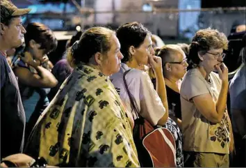  ??  ?? Hundreds of poor and underinsur­ed people come to the Remote Area Medical clinic in Wise, Va., every year. The vast majority of them come for dental services ranging from root canals to extraction­s.