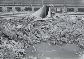  ??  ?? The bomb crater at Roker Park in 1943 after an air raid. Joe remembers watching Sunderland during the war years.