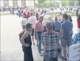  ?? PHOTOS BY ROSS D. FRANKLIN — THE ASSOCIATED PRESS ?? People wait in line before being allowed inside the Arizona state senate building to watch the election review hearing proceeding­s at the Arizona Capitol on Friday.