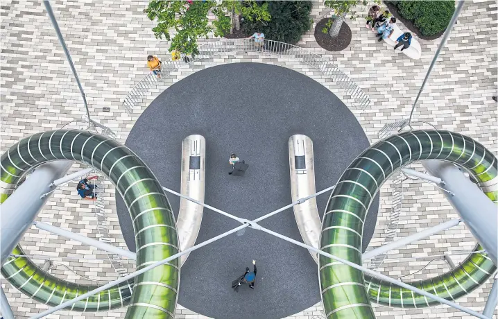  ??  ?? Aventura Mall in Florida began offering rides down a nine-storey, double-chute tower slide in 2017.