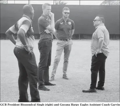  ?? ?? GCB President Bissoondya­l Singh (right) and Guyana Harpy Eagles Assistant Coach Garvin Nedd (left) interact with CWI HP Manager Graeme West (2nd from left) and Coach Education Head Chris Brabazon (2nd from right).
National Stadium, the Fitness53
gym, and the LBI hostel were the