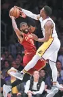  ?? AP ?? Cleveland Cavaliers’ Kyrie Irving has his pass blocked by LA Lakers’ David Nwaba on Sunday in Los Angeles.