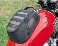  ??  ?? Magnetic tank bag swallows all the essentials