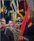  ??  ?? Cpl Kyle Laird, 15, of the Royal British Legion Scotland, holds his flag at an event in Edinburgh Castle