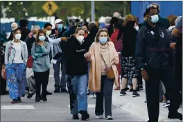  ?? LYNNE SLADKY — THE ASSOCIATED PRESS FILE ?? People arrive at Jackson Memorial Hospital in Miami on Wednesday to receive the COVID-19 vaccine.