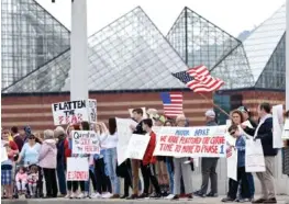  ?? STAFF PHOTO BY ROBIN RUDD ?? Hamilton County’s last coronaviru­s death was reported on April 18. The next day, these protesters seeking an easing of public health measures carried signs saying the COVID-19 case curve had been flattened.