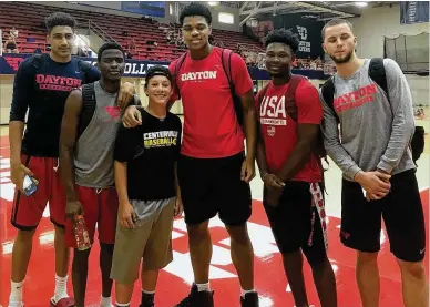  ?? PHOTO COURTESY OF CHRIS KING ?? Dayton freshmen (from left) Obadiah Toppin, Jalen Crutcher, Jordan Pierce, Jordan Davis and Matej Svoboda with camp member Chris King (third from left) at a July basketball camp at UD’s Frericks Center.