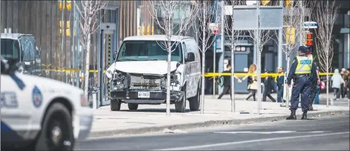  ?? CP PHOTO ?? Police are seen near a damaged van in Toronto after a van mounted a sidewalk crashing into a number of pedestrian­s on Monday.