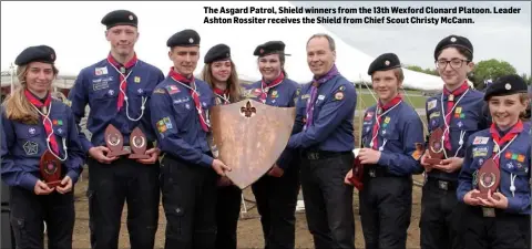  ??  ?? The Asgard Patrol, Shield winners from the 13th Wexford Clonard Platoon. Leader Ashton Rossiter receives the Shield from Chief Scout Christy McCann.