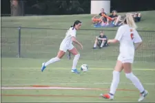  ?? SUBMITTED PHOTO — UVA ATHLETICS ?? Former UVA defender and Academy of Notre Dame grad Phoebe McClernon dribbles the ball during her career at Virginia.