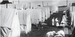  ??  ?? KILLER BUG: Nurses caring for victims of the deadly Spanish flu in 1918