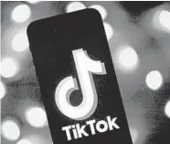  ?? LIONEL BONAVENTUR­E/GETTY-AFP ?? TikTok has become a target of President Donald Trump, who said he would ban the social media app in the U.S.