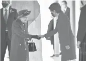  ?? JEFF J MITCHELL/GETTY ?? Queen Elizabeth II shakes hands with First Minister Nicola Sturgeon on Saturday at the sixth session of the Scottish Parliament in Edinburgh, Scotland.