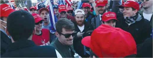  ?? (Leah Millis/Reuters) ?? NICK FUENTES makes his way through the crowd at a ‘Stop the Steal/Million MAGA March’ protest in Washington, last November.
