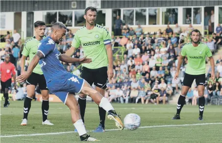  ??  ?? Kemar Roofe fires home Leeds United’s first goal in their 2-1 friendly success at Forest Green Rovers last night.