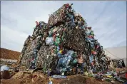  ?? SERGEI GRITS / ASSOCIATED PRESS 2015 ?? Plastic trash is compacted into bales for further processing at a waste dump near Minsk, Belarus. Plastics production is accelerati­ng.