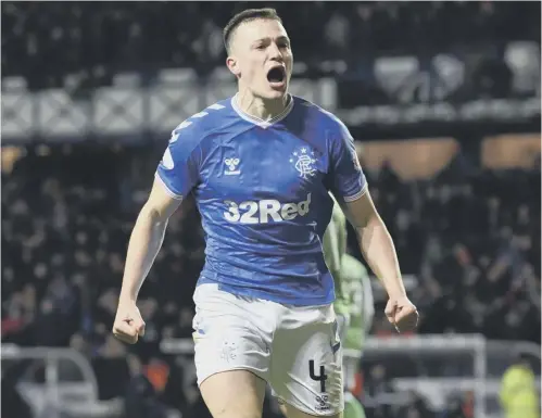  ??  ?? 0 George Edmundson celebrates scoring Rangers’ equaliser against Hibs on Wednesday. ‘I felt I’d redeemed myself’ he said.