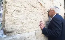  ?? AP ?? US Ambassador to Israel David Friedman kisses the stones of the Western Wall, the holiest site where Jews can pray in Jerusalem’s Old City, yesterday.