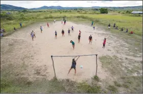  ?? (File Photo/AP/Andre Penner) ?? Indigenous people from the Macuxi ethnic group play soccer Nov. 6 in the Maturuca community on the Raposa Serra do Sol Indigenous reserve where mining is illegal in Roraima state, Brazil. President Jair Bolsonaro publicly opposed Raposa Serra do Sol’s demarcatio­n in 2005 and often holds it up as an example of a large swath of land ripe for productive activities.