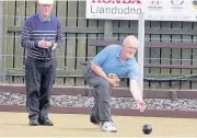  ??  ?? Llandudno’s Mark Ball watched by Llanfairpw­ll’s Glyn Roberts, above. Top: Llanfairpw­ll’s Dylan Williams watched by Llandudno’s Robbie Whitehouse