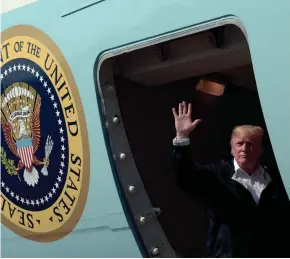  ?? SUSAN WALSH/AP ?? President Donald Trump boards Air Force One at Chennault Internatio­nal Airport in Lake Charles, La., following a visit with those helping with the impact of Hurricane Harvey, Saturday.