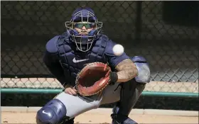  ?? AP PHOTO/MORRY GASH ?? Milwaukee Brewers catcher William Contreras catches during a spring training baseball workout Thursday, Feb. 16, 2023, in Phoenix.