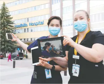  ?? DARREN MAKOWICHUK ?? Dr. Khue-tu Nguyen, left and Dr. Kimberley Nix are helping raise money for tablets to help Foothills Hospital patients communicat­e with family.