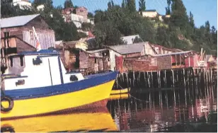  ??  ?? Top: Hordern’s Twister tied to a wharf at Papeete. Above: having made it safely to Castro on Chile’s Isla Chiloé, Hordern was later swept overboard on the return passage to New Zealand