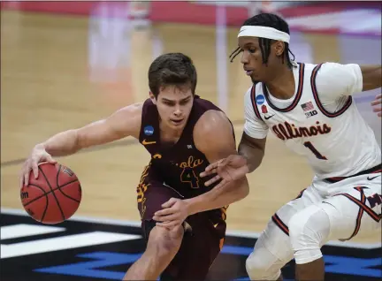  ?? PAUL SANCYA - THE ASSOCIATED PRESS ?? Loyola Chicago guard Braden Norris (4) drives on Illinois guard Trent Frazier (1) during the second half of a men’s college basketball game in the second round of the NCAA tournament at Bankers Life Fieldhouse in Indianapol­is, Sunday, March 21, 2021.