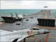  ?? MO XIAOLIANG / FOR CHINA DAILY ?? A J-15 fighter takes off from the Liaoning on Friday during a fleet training exercise in the Yellow Sea.