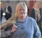  ??  ?? SMILING: Glynnis Breytenbac­h leaves the Pretoria North Magistrate’s Court after judgment was handed down.