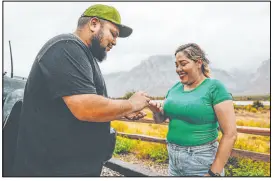  ?? Madeline Carter Las Vegas Review-journal ?? Eddie
Hernandez, left, puts an engagement ring on Janette Espejo’s finger after proposing to her Sunday while at a lookout point in the Red Rock National Conservati­on Area in Las Vegas.