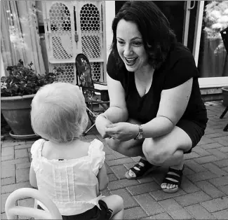  ?? PAUL DARROW / NATIONAL POST ?? Dr. Lara Hazelton gets in some play time with her daughter at her Halifax home.