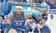  ?? STEPHEN M. DOWELL/ORLANDO SENTINEL ?? The Magic’s Terrence Ross, left, who picked up playoff experience with the Raptors, said there are no easy games at this point.