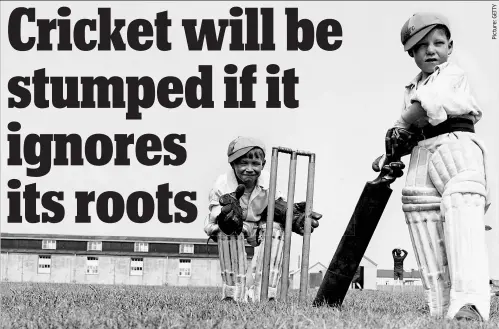  ??  ?? Howzat! Two little boys in their fathers’ pads and gloves have fun playing cricket in Dymchurch, Kent, in 1931