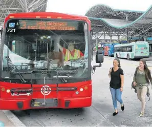  ?? JOE BURBANK/ORLANDO SENTINEL PHOTOS ?? Passengers prepare to board a Lynx bus at the main station in downtown Orlando, Wednesday. Lynx will get $9 million more from Orange County next year, if the proposed county budget is approved.